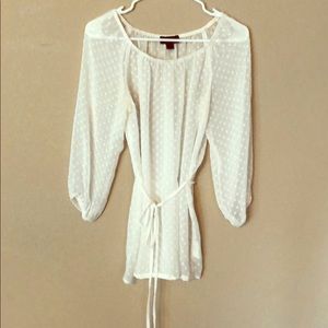 Sheer white blouse with polka dot accent